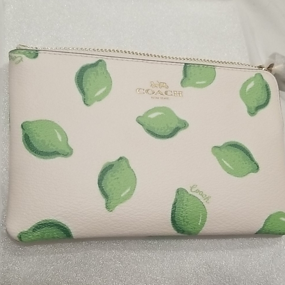 Coach Handbags - Coach lime wristlet NWT corner zip white green